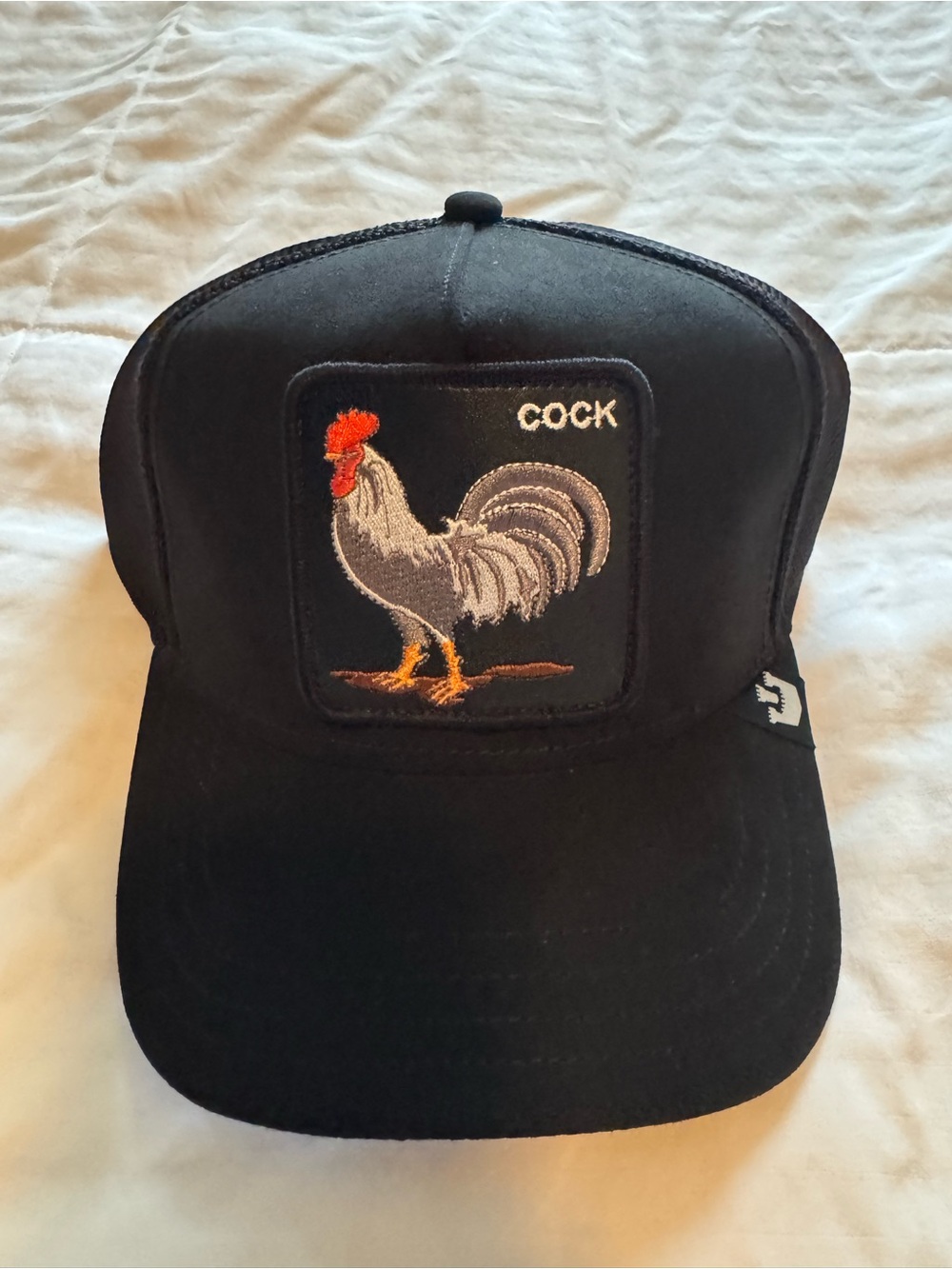 Goorin Bros Black Trucker Cap with Rooster Patch.
